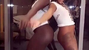 Two hot Brazilian lesbians dance and flash their sticky pussies on New Year's.