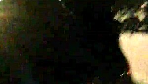 cd in latex walks outdoors with vibrator attached