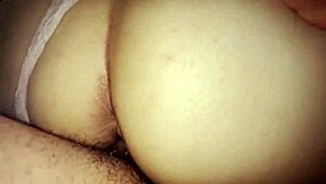 The Mexican Latina MILF schoolgirl bends over in her short skirt, exposing her big ass for doggystyle pounding.