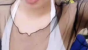 asian stripper teasing with clothes ripped during striptease