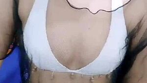 asian stripper teasing with clothes ripped during striptease