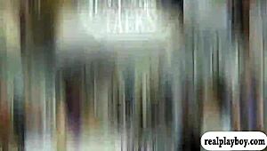 Girl in monofins swims topless for cash in public.