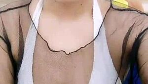 asian stripper teasing with clothes ripped during striptease