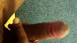 Watch this black guy rubbing his monster cock.