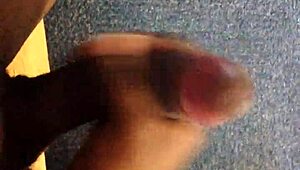 Watch this black guy rubbing his monster cock.