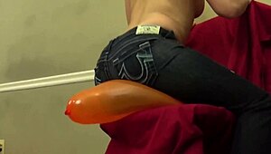 Hey, watch Fifi Foxx sit and pop balloons topless