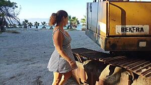 Big-assed girl gets soaked on a tractor