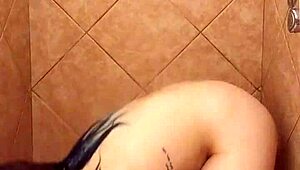 Milf showers and bathes in voyeur scene