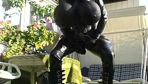 Roxina Torpedo Doll Stuns in Rubber Outfit at Garden Scene. Nature Meets Kink in Wild Display.