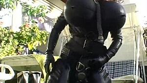 Roxina Torpedo Doll Stuns in Rubber Outfit at Garden Scene. Nature Meets Kink in Wild Display.