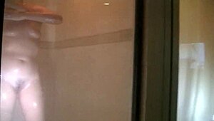 Amateur couple shares hotel room and shower with viewers