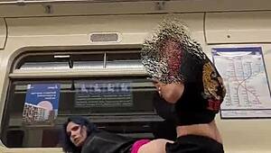 Passionate couple engages in open-air intimacy on a commuter train