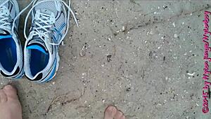 Chubby girl flaunts her feet in sexy pantyhose on the beach
