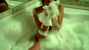 Tiny red slut with perfect body teases in the bathtub. Her fingering game is pure fire.