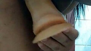 Latina brunette masturbates with dildo in bathroom homemade