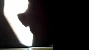 she masturbates in the shadows, playing with herself