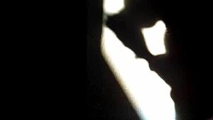 she masturbates in the shadows, playing with herself