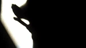 she masturbates in the shadows, playing with herself