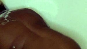 ebony babe relaxes in bath with subtle touches