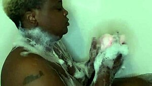 ebony babe relaxes in bath with subtle touches