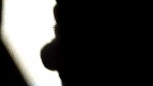 she masturbates in the shadows, playing with herself