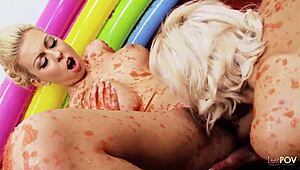 Busty blondes wrestle in jello and finger each other intensely