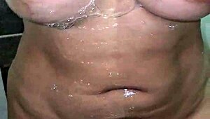 Mature Mom Uses Dildo in Bathroom