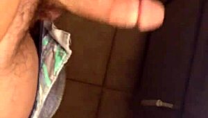 This sexy babe plays with a huge cock, sucking and masturbating it