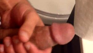 This sexy babe plays with a huge cock, sucking and masturbating it