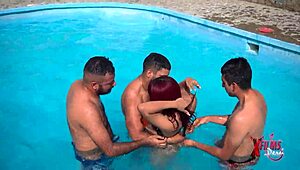 Redhead enjoys pool party with friends