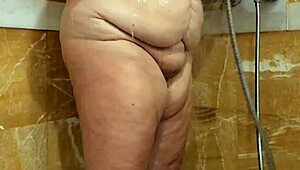A voluptuous Latina woman enjoys a shower while feeling horny
