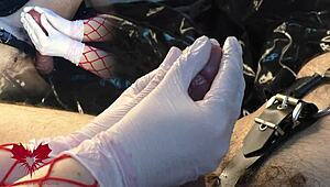 the mistress jerks my cock with white gloves, and i cum as she uses the dilator on my urethra