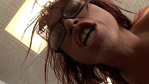 redheaded milf nikki hunter with glasses moans as her tight hairless pussy gets stuffed with a big cock