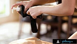 A seductive masseuse indulges in a sensual oil massage with her attractive client, leading to passionate lesbian encounters.