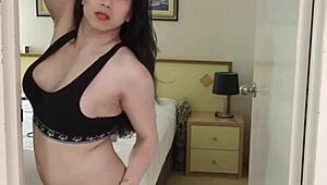 Gorgeous shemale strips naked, revealing big ass and tits with monster cock