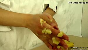 Japanese handjob crushes messy banana in fetish food play