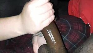 Stroking that massive black cock hard