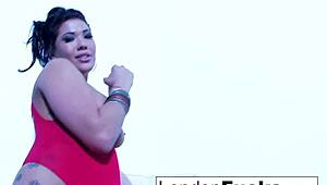 London Keyes in sexy red lingerie on white chair