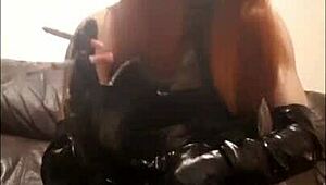 T-girl in PVC outfit smokes two cigarettes simultaneously