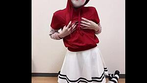 A girl in a short skirt slowly masturbates, touching herself under the fabric while fantasizing about being watched.