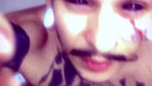 Guy plays with his cum like paint