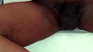 A young, well-endowed black man indulges in self-pleasure and explosive ejaculation, not to be missed
