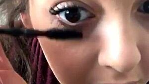 Sexy beauty admires her tits in the mirror