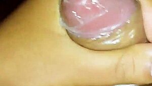 Gay guy cumming inside the condom during intense sex