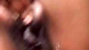 Ebony teen squirts during intense fingering!