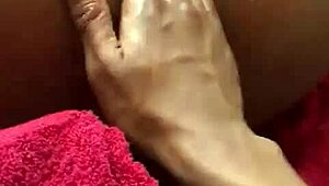 Ebony teen squirts during intense fingering!