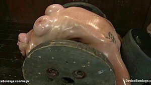 Why is this busty lesbian slave arched back?