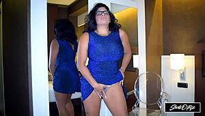 Watch this pretty babe tease her big tits and pussy in a hot striptease!