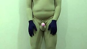 slave in zentai gets femdom cbt on penis