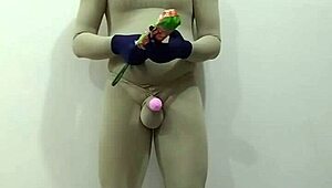 slave in zentai gets femdom cbt on penis